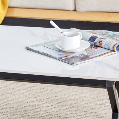 A Coffee Table Made Of Rock Slab Material, With A Smooth And Natural Surface That Complements The Modern Design Of The Black Metal Legs, Making It Suitable For Living Rooms Of All Sizes.47X23.6
